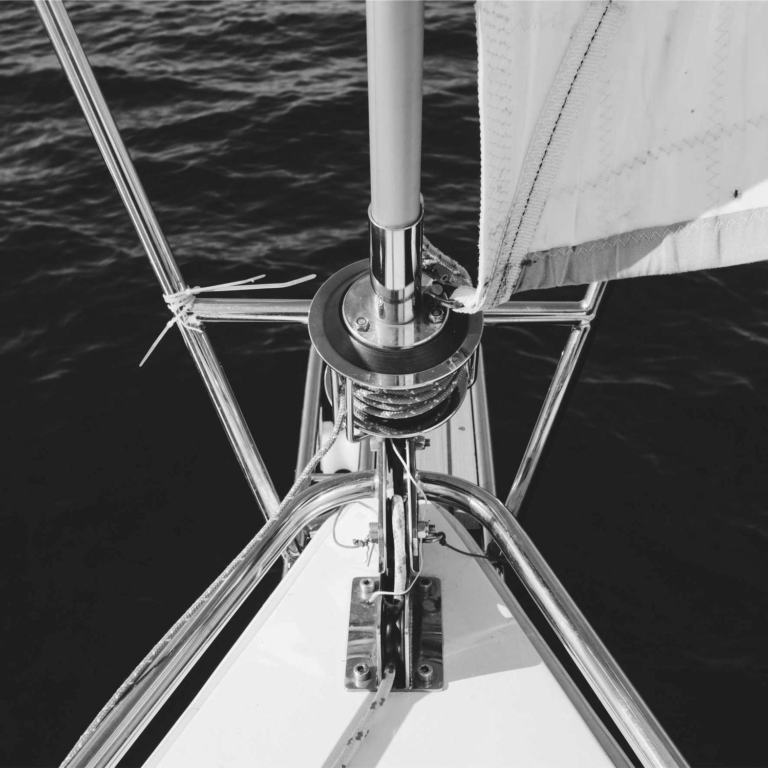 On deck under sail rigging, wind in the shirt