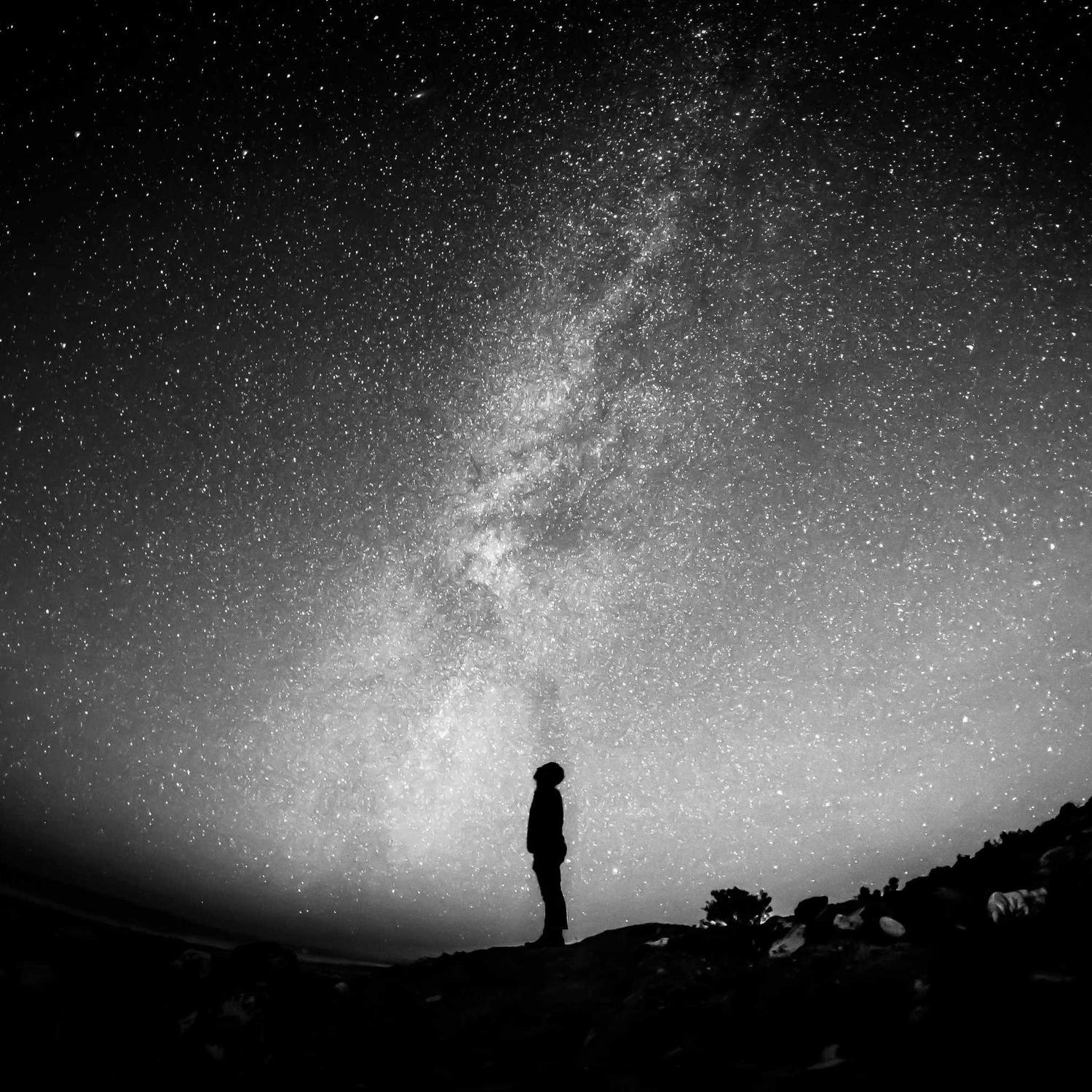 Lone figure under a night sky, long exposure